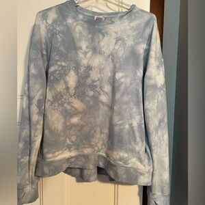 All in Motion blue tie-dye sweatshirt, sleeves have thumb holes, side pockets
